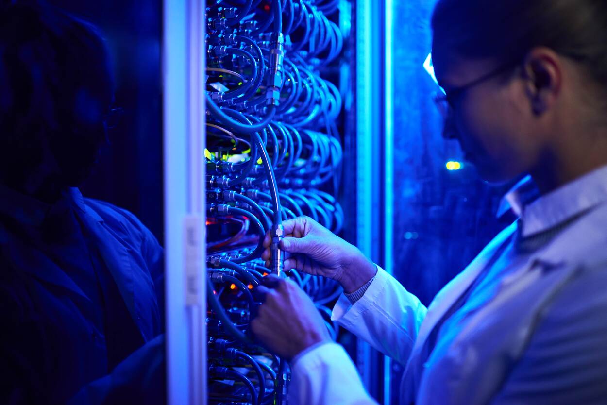 Female scientist working with super computer